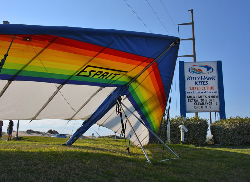 A Hang Glider sitting in front of Kitty Hawk Kites